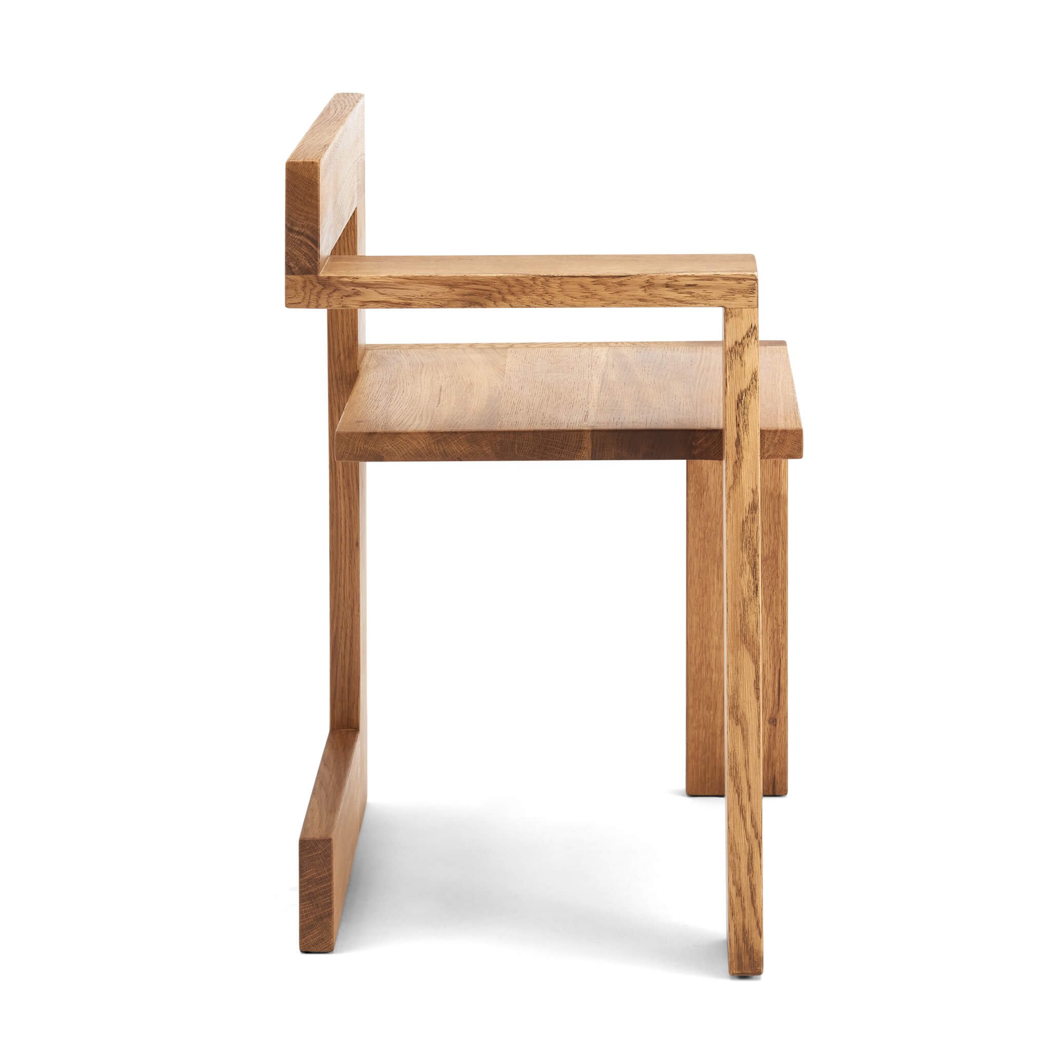 A wooden chair with cantilever-like frame, minimalistic geometric design.