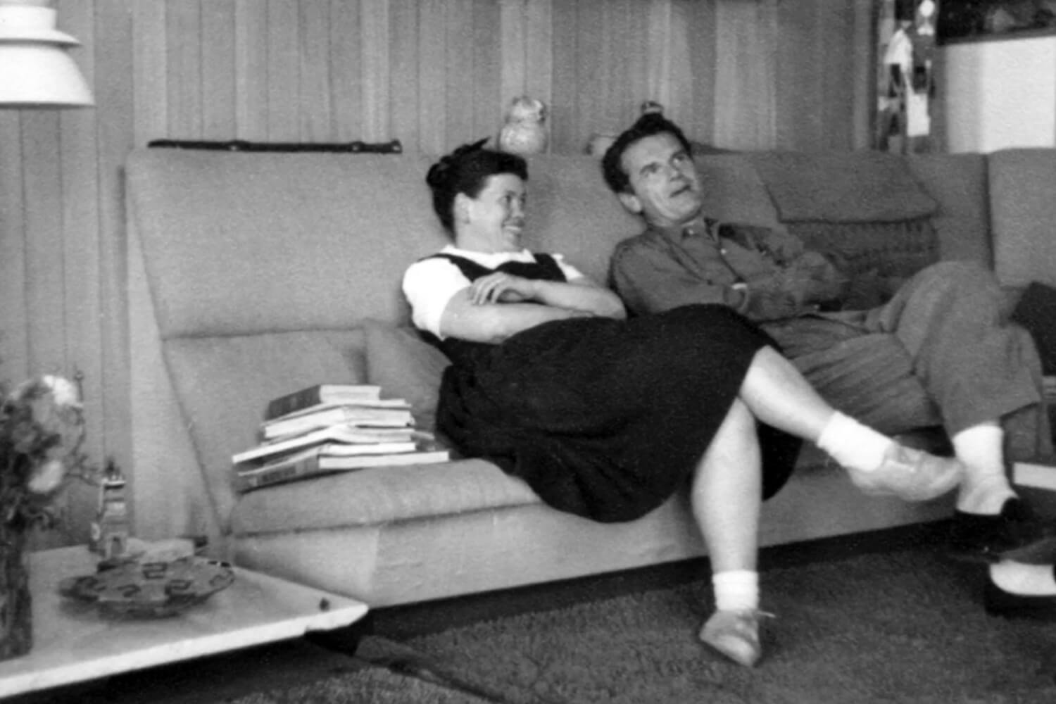 Charles Eames and his wife, Ray Eames, are sitting in their home.