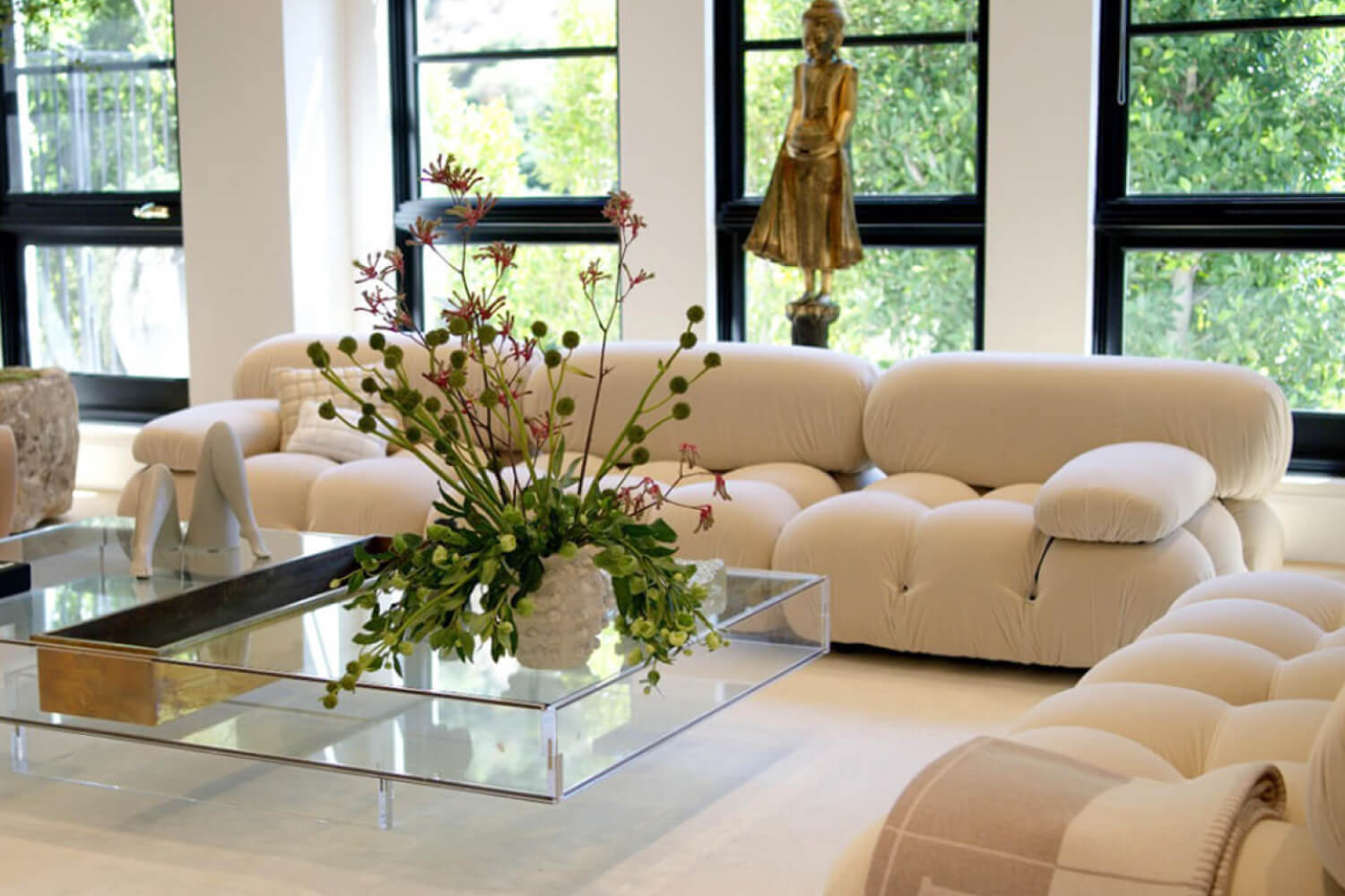 A bright living room featuring a Mario Bellini sofa.