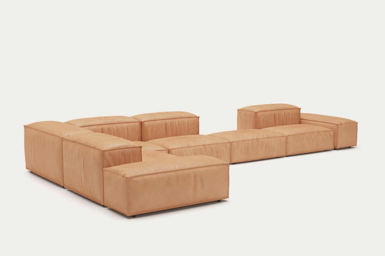 Image of an 'Extrasoft Low Profile Modular Block Sofa | Combination 003' featuring several plush modules in light tan leather. The sofa has a modern, low-to-the-ground design with generous cushioning, creating an inviting and stylish look.