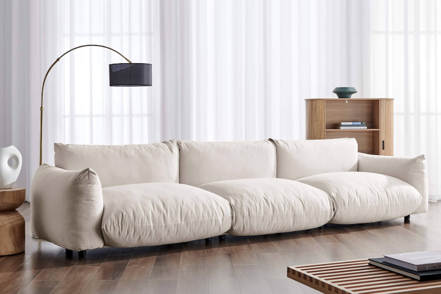 Spacious, contemporary living room with a Marenco sofa featuring plush, oversized cushions. 